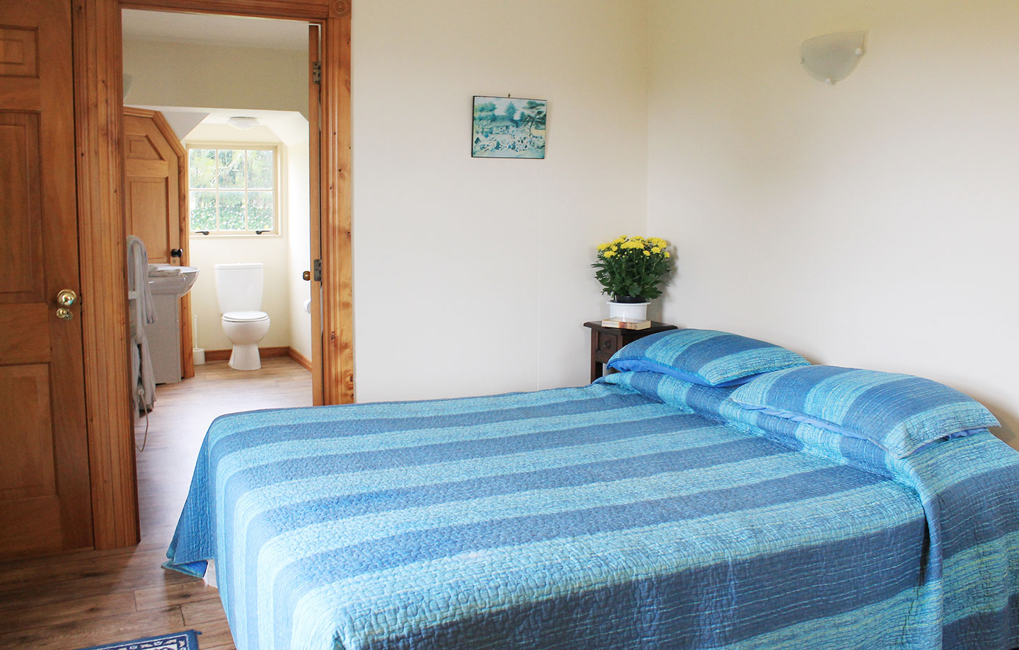 bedroom with king bed and ensuite at the carriage house kerikeri