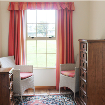 seating area in the king bedroom the carriage house kerikeri